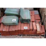 A pallet of red bricks