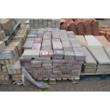 A pallet of paving bricks