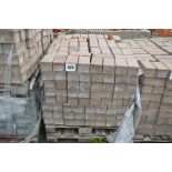 A pallet of paving bricks