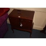 A walnut record cabinet