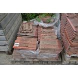 A pallet of concrete roof tiles