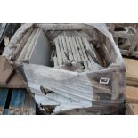 A crate of various sized stoneware slabs