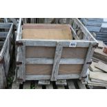 A crate of large stoneware slabs and a pallet of s