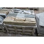 A crate of sandstone and slate slabs