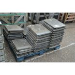 A quantity of flat concrete tiles