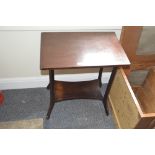 An Edwardian mahogany two tier occasional table