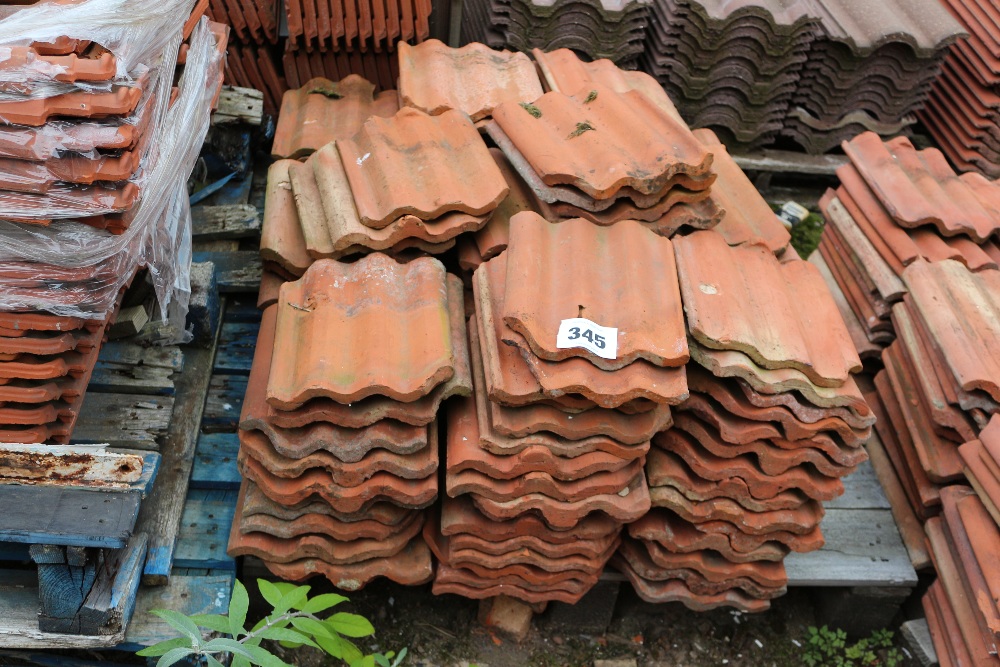 A pallet of re-claimed red rippled tiles