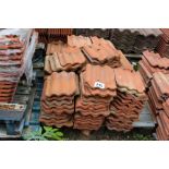 A pallet of re-claimed red rippled tiles