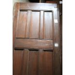 A large pair of pine panelled doors