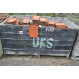 A crate of terracotta tiles