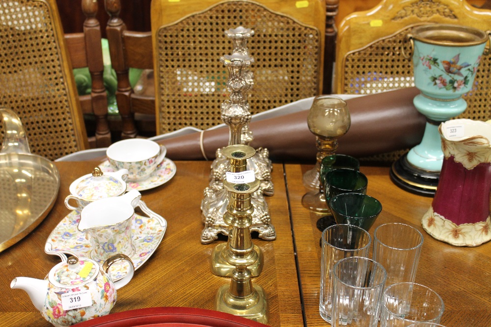 A pair of Victorian brass candlesticks and a pair