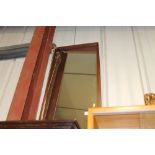 A long teak framed mirror