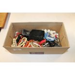 A box containing various necklaces to include a co