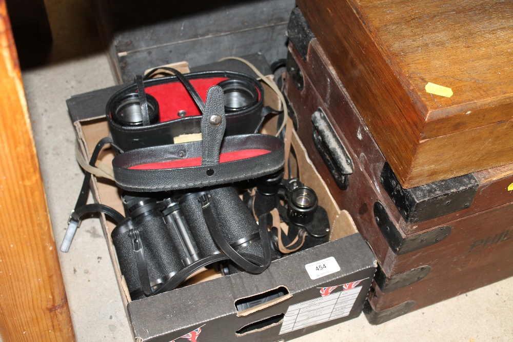 A box of various binoculars