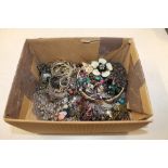 A box of various costume jewellery