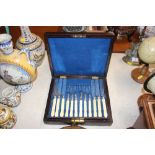 A cased set of silver plated fruit knives and fork
