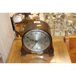 A Smiths oak cased two hole mantel clock