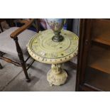 An oriental style resin and glass topped table