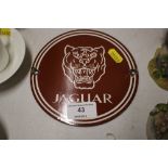 A modern small enamel Jaguar advertising plaque
