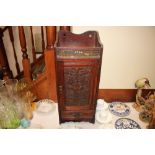 An early 20th Century oak smokers cabinet fitted s