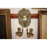 A 19th Century brass two branch wall sconce mounte