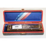 A Hohner harmonica in original box