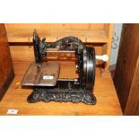 A Princess of Wales hand sewing machine contained