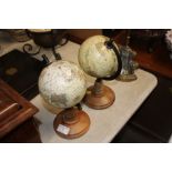 A pair of small table top library globes
