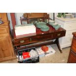 A leather topped and mahogany writing table with s