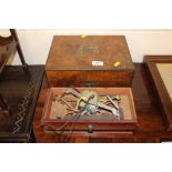 A Victorian walnut and brass bound box; together w