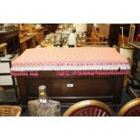 A small oak and upholstered storage chest