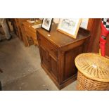 An oak single drawer side cupboard