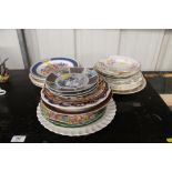 A quantity of various decorative plates