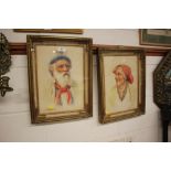 A pair of gilt framed coloured portrait prints of