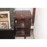 An Edwardian mahogany and inlaid swivel bookcase