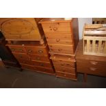 A pair of pine bedside chests fitted three drawers