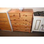 A modern pine chest fitted two short over four lon