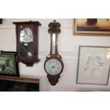 An oak cased banjo barometer with card decoration