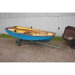 A dinghy with cover and trailer