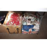 Two boxes containing curtains and various material