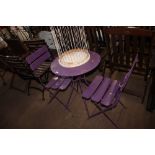 A purple painted bistro set