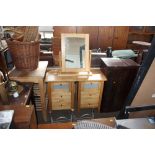 A pair of bedside chests fitted three drawers toge
