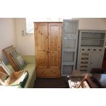 A modern pine two door wardrobe fitted single draw