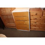 A white painted chest fitted five drawers