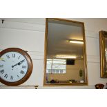 An oblong wall mirror