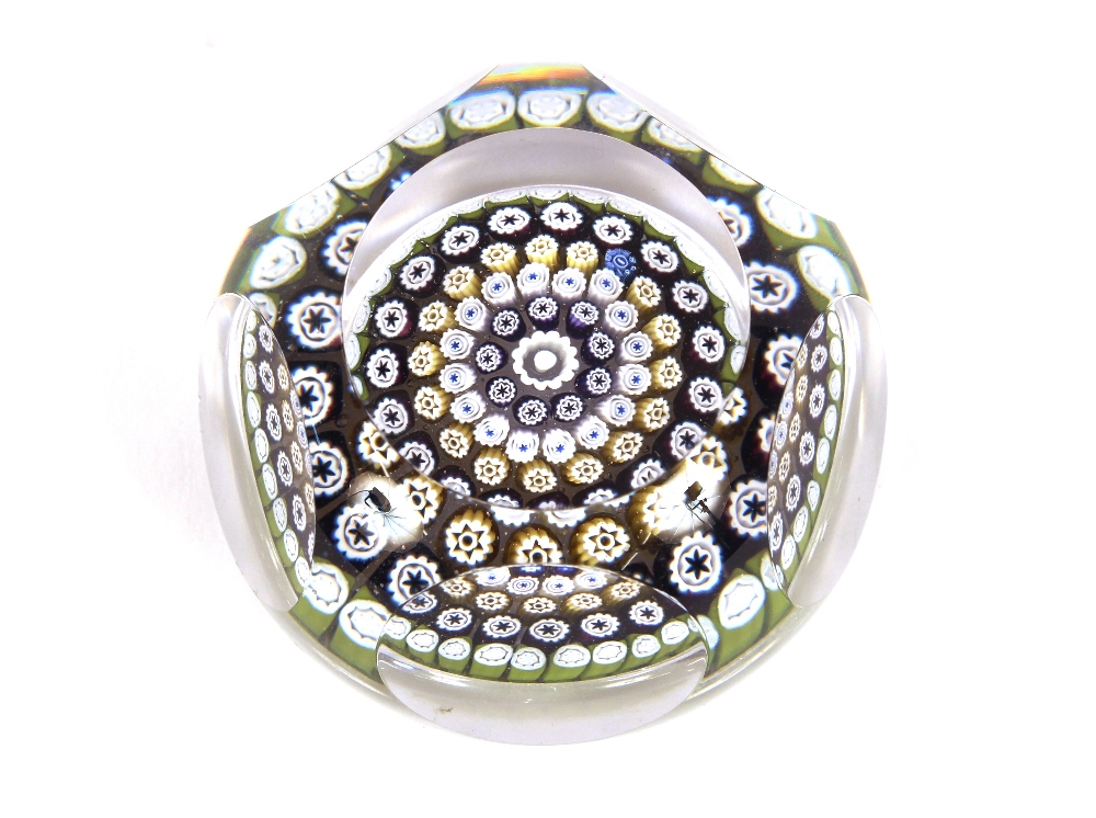 A Millefoire glass paperweight, with thumb press d