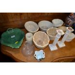 A quantity of pottery jelly moulds; a Victorian gr