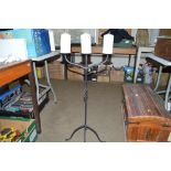 A wrought iron candle stand