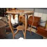 A mahogany two tier window table