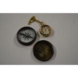 A brass cased compass and pocket watch